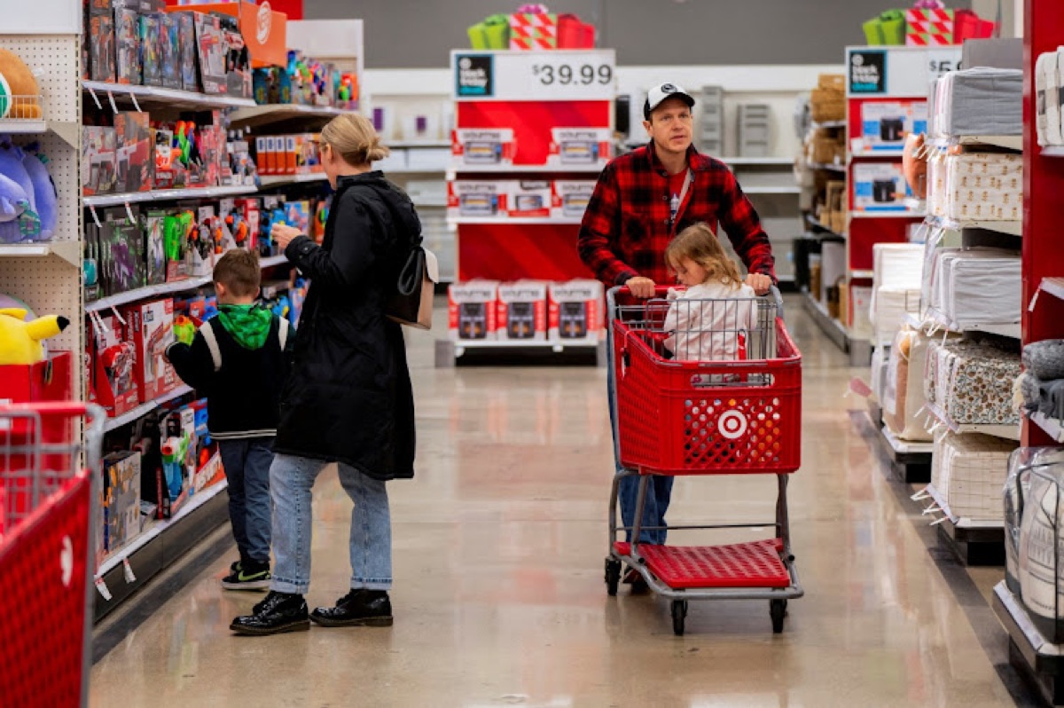 Shoppers in a Target aisle with a cart